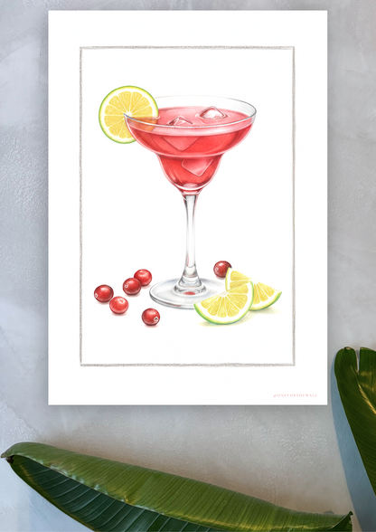 Cosmopolitan plakat på lys blå kalkvæg med palmeblade – nordisk cocktailkunst